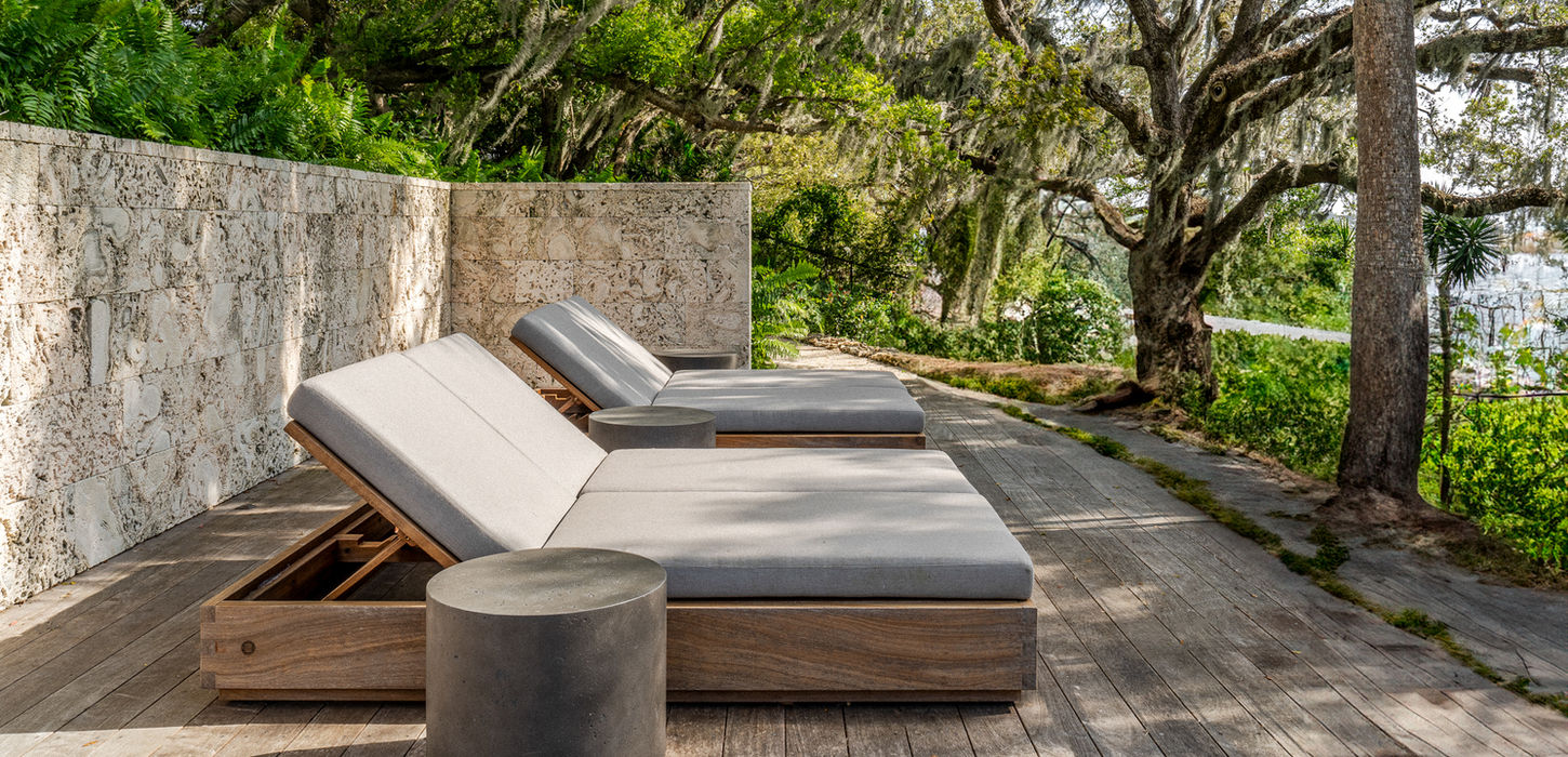 Studio JAC furniture shown in situ within refined architectural spaces, highlighting material, proportion, and spatial context.