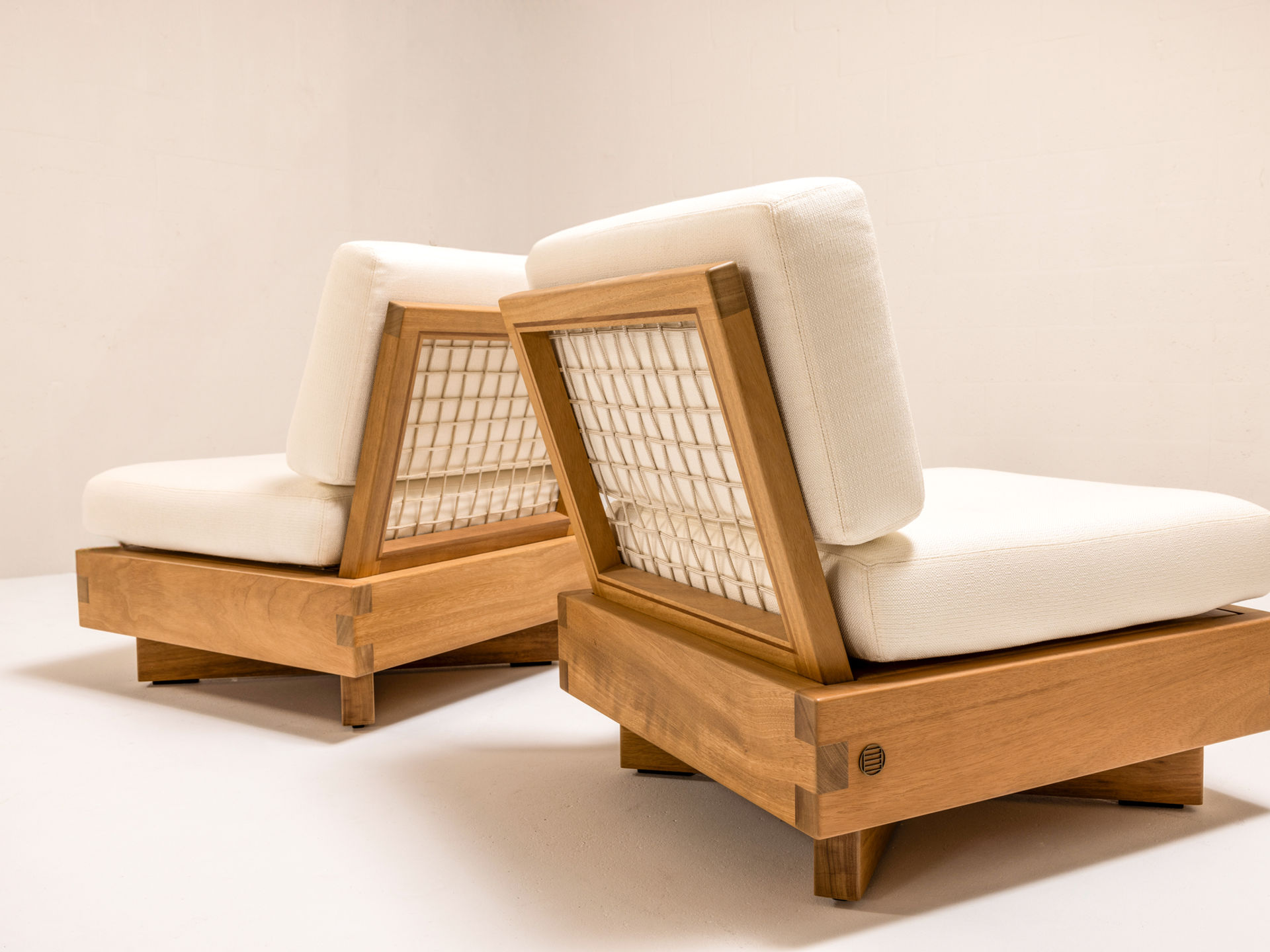 DI LIDO Collection by Studio JAC featuring modern outdoor furniture crafted from solid Iroko, with woven rope detailing, low-slung profiles, and architectural form designed for relaxed outdoor living.