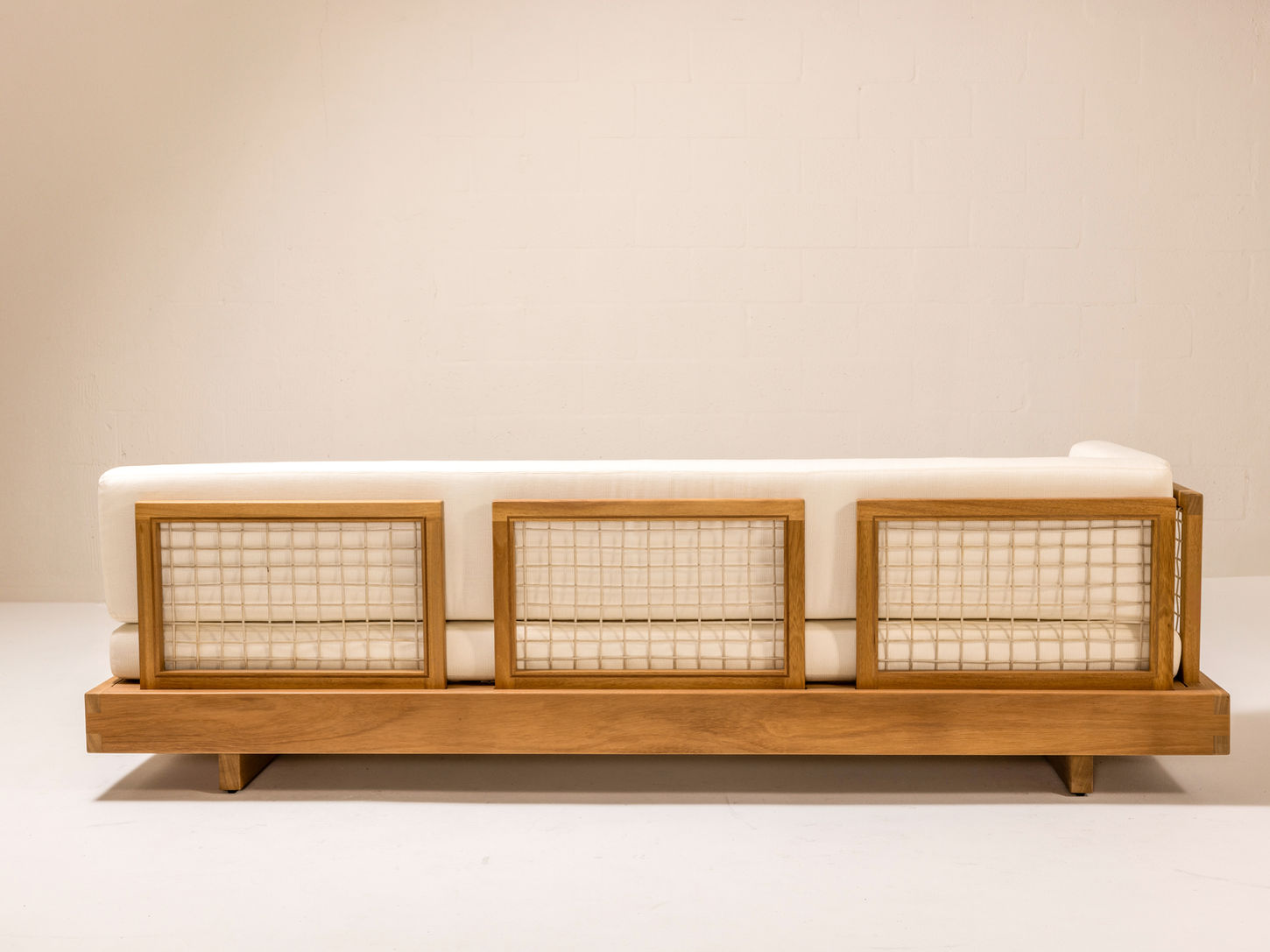 DI LIDO Collection by Studio JAC featuring modern outdoor furniture crafted from solid Iroko, with woven rope detailing, low-slung profiles, and architectural form designed for relaxed outdoor living.