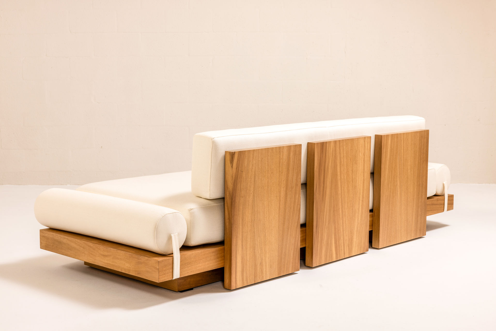 ARÉ Collection by Cristina Recio crafted from solid Iroko wood, featuring minimalist outdoor furniture with clean lines, natural materials, and architectural form.