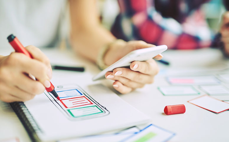 Woman designing a mobile app