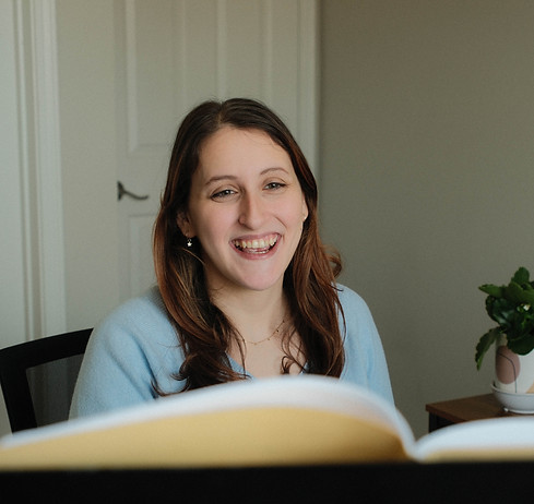 Voice teacher Lauren looks at sheet music