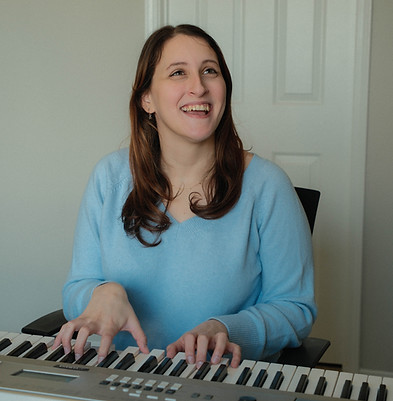 Voice teacher Lauren plays piano at a voice lesson