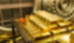 Lingotes de oro y una bóveda en el fondo