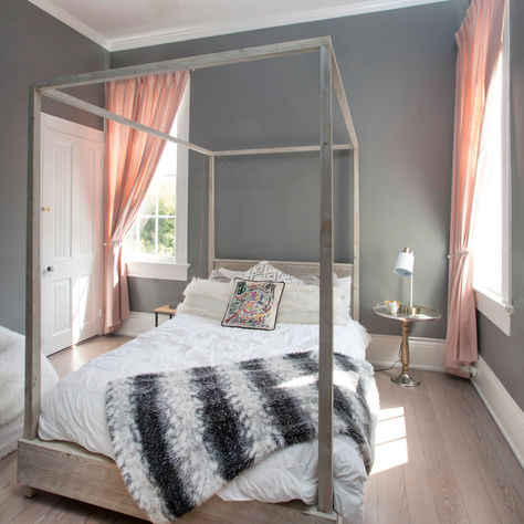 blush pink drapes in bedroom with canopy bed