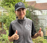 Happy cleaner smiling with thumbs up in London