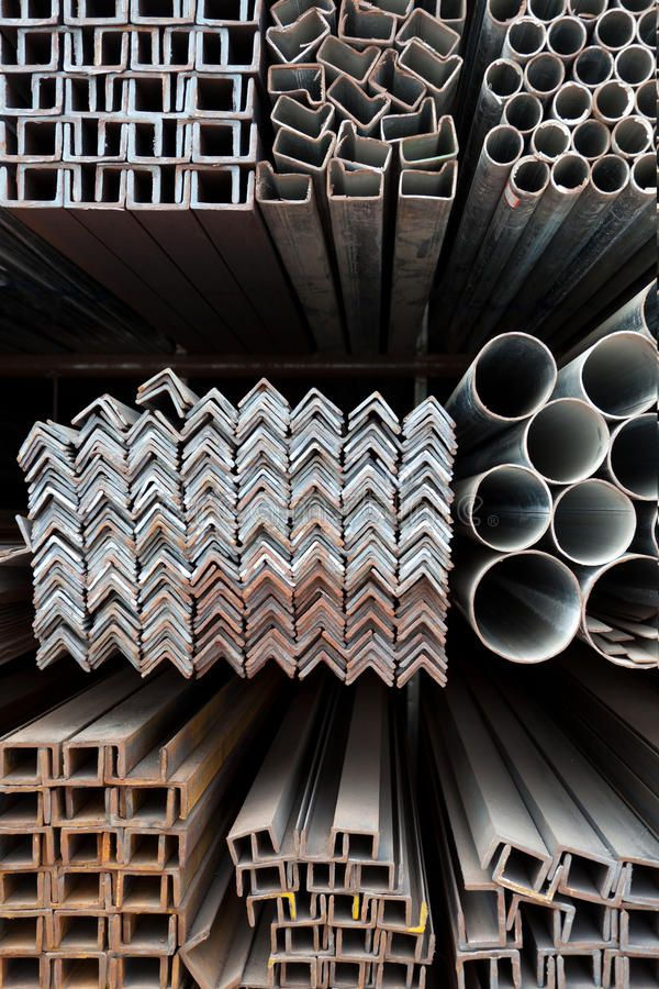 Stacks of angle iron and GI pipe scrap for buyers.