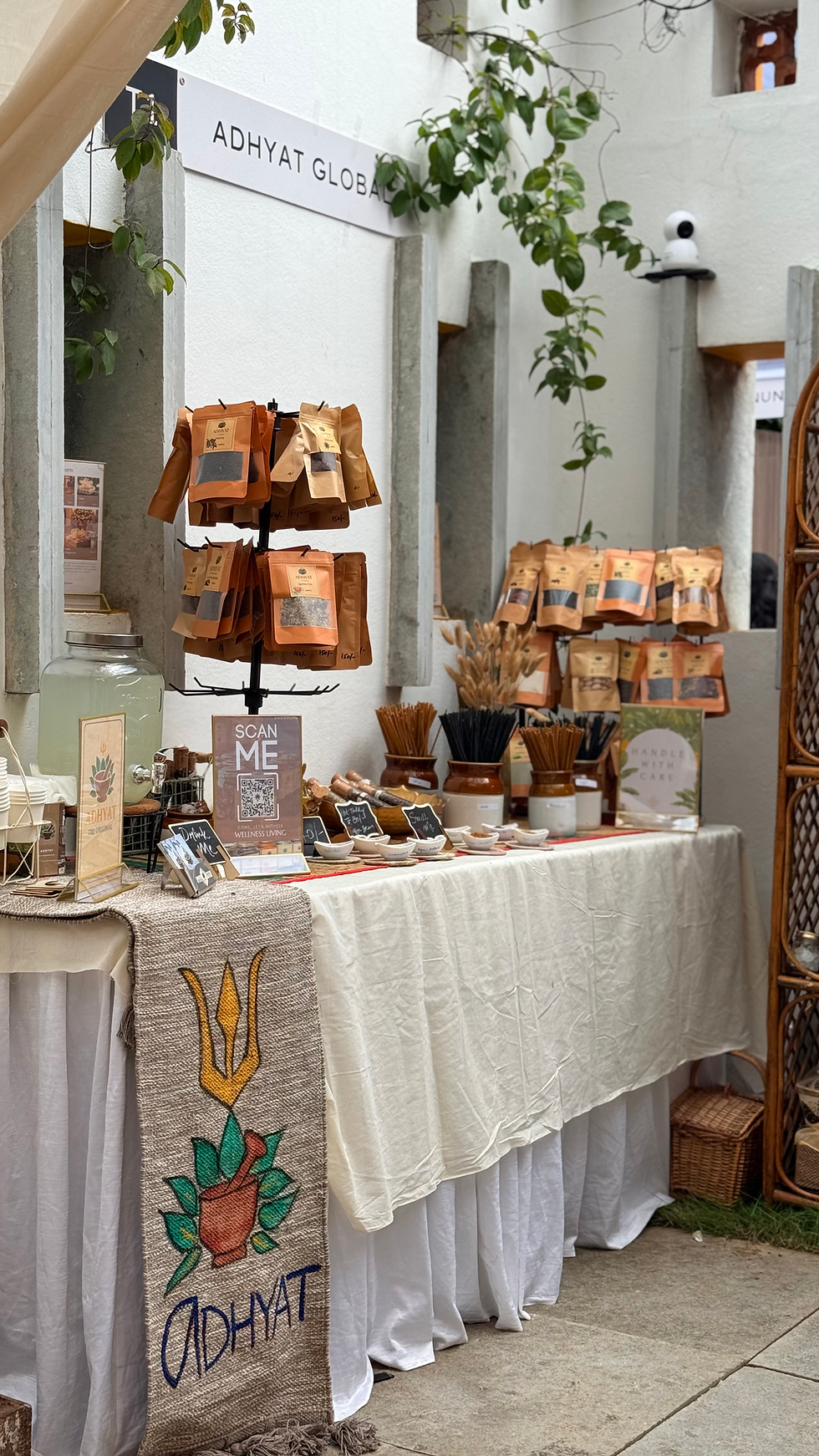 A beautifully arranged stall showcasing traditional, nature-inspired products by Adhyat Global, reflecting the golden touch of heritage craftsmanship.