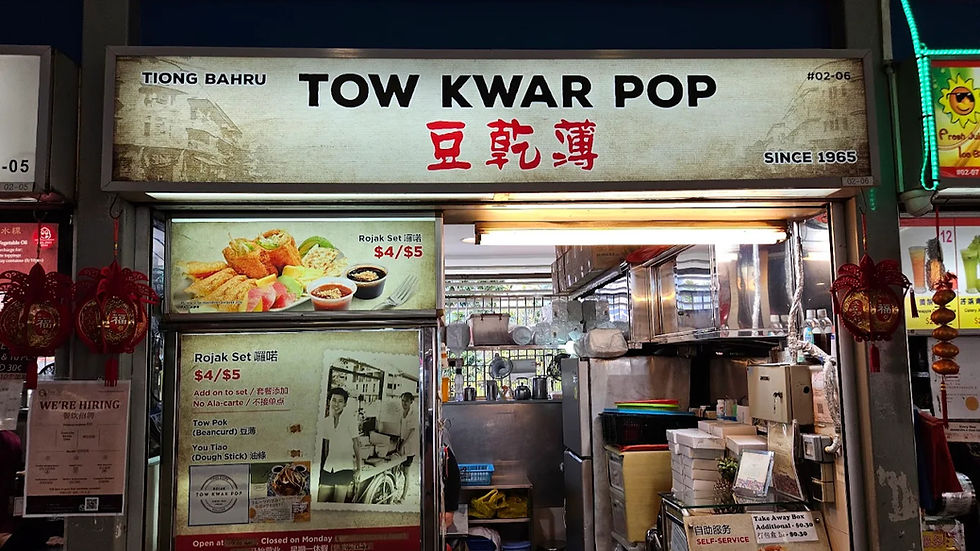 Stall sign "Tow Kwar Pop" with retro decor. Below, Rojak set menu prices $4/$5 displayed. Inside kitchen, cooking utensils are visible.
