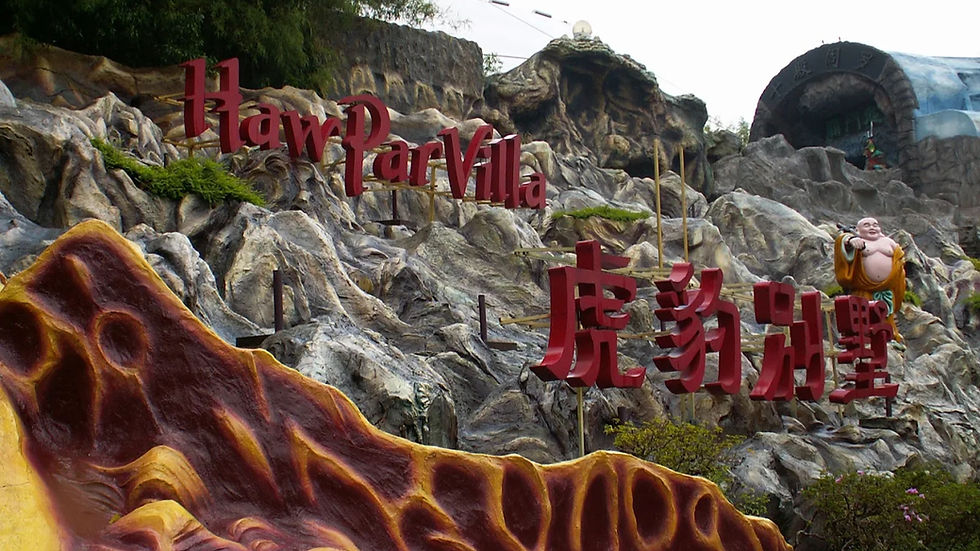Haw Par Villa entrance with rocky background, large red text, and a smiling Buddha statue. Earthy colors and lush greenery present.