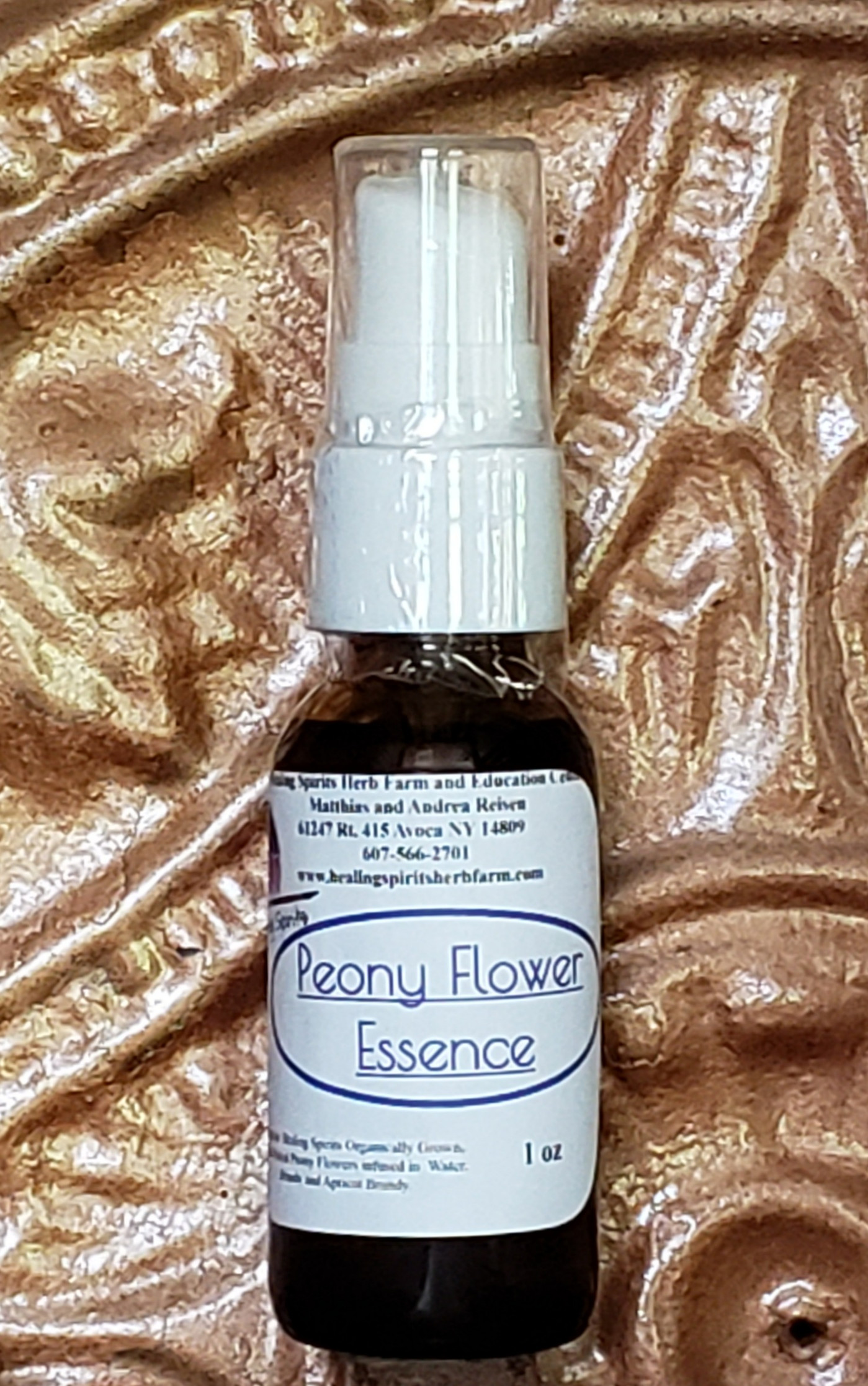 Peony Flower Essence bottle capturing the light.