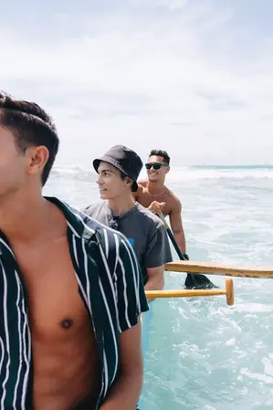 People paddling through clear waters on an authentic canoe tour in Honolulu