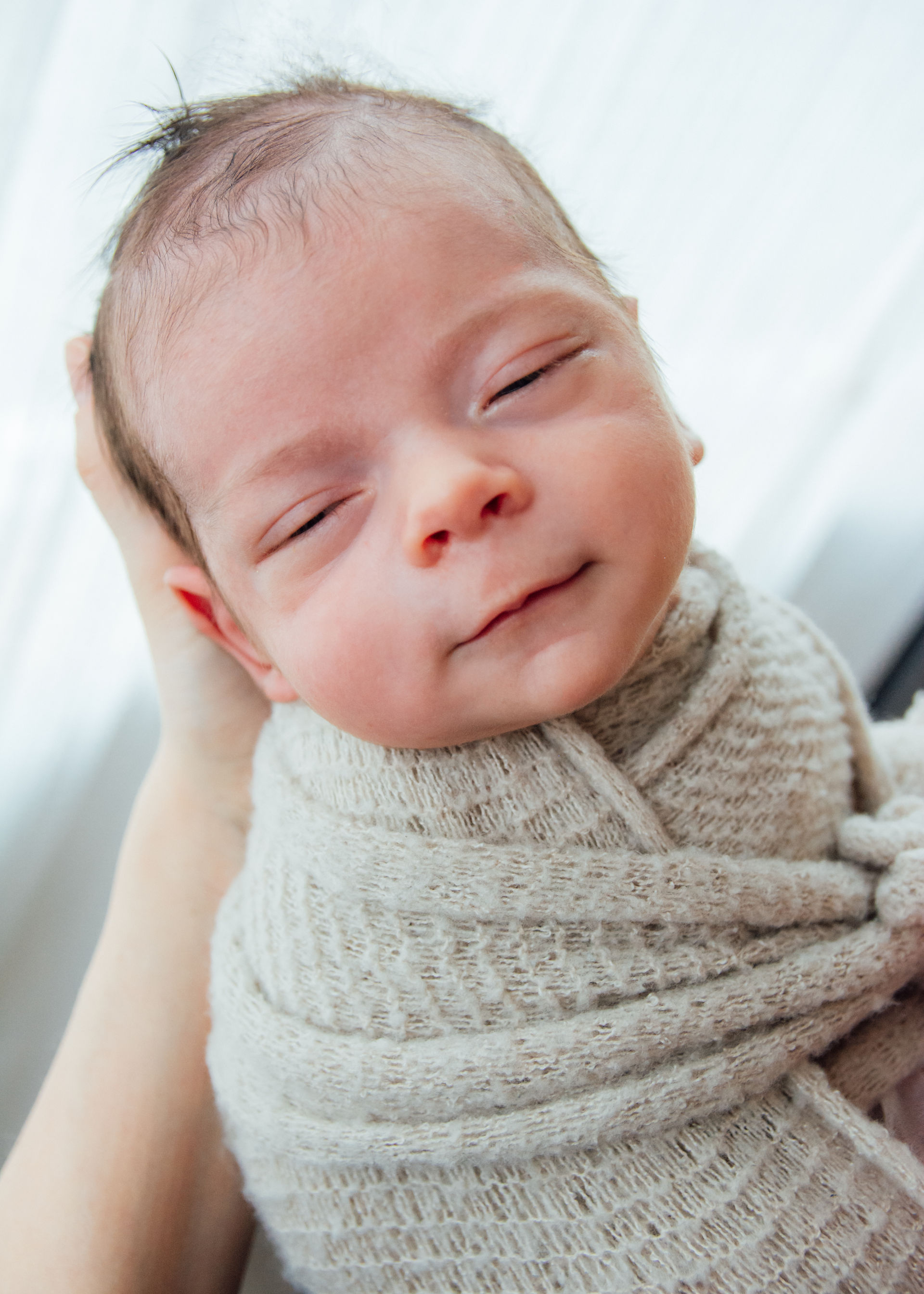 Modern newborn photography with white backdrop in Vancouver studio