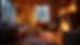 Eye-level view of a cozy living room decorated with Christmas lights and a fireplace