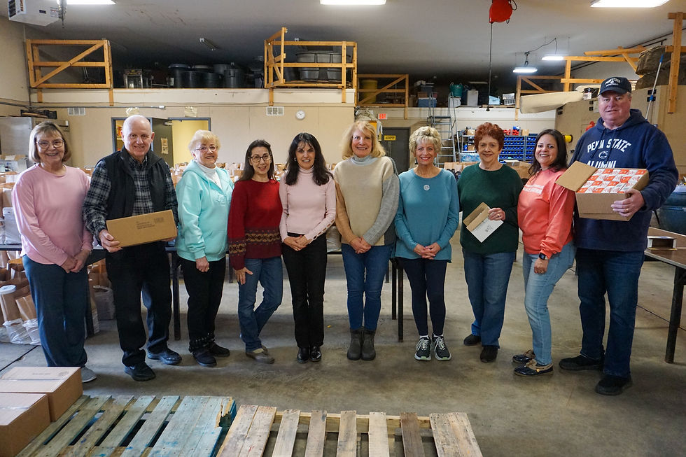 Gleaners Food Bank volunteers. Heery is pictured centered (pink sweater).
