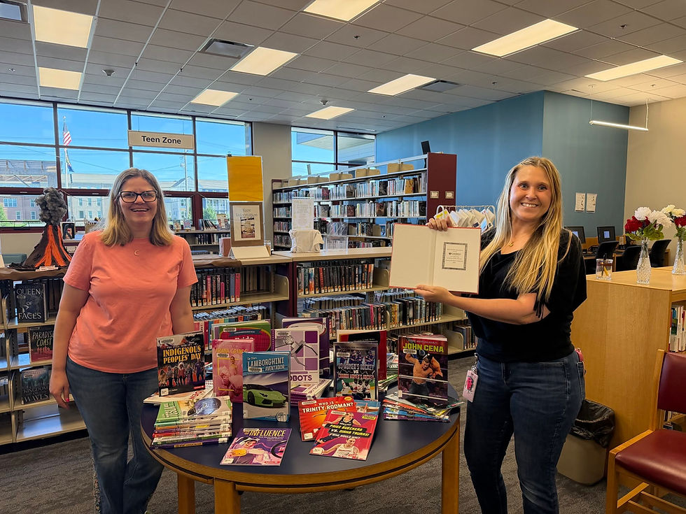 Cranberry Public Library staff show off the new book additions made possible thanks to a Cranberry Foundation community grant. *Pictures courtesy of the Cranberry Public Library.