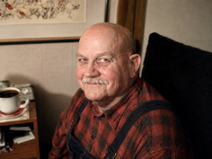 My father - with a warm, friendly, and slightly mischievous smile