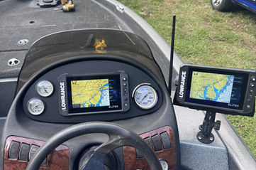 Boat helm with chartplotter, VHF radio and engine controls