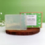 An image showing the TwachaKalp refreshing aloe vera soap bar and its box cover, both placed on a wooden platter.