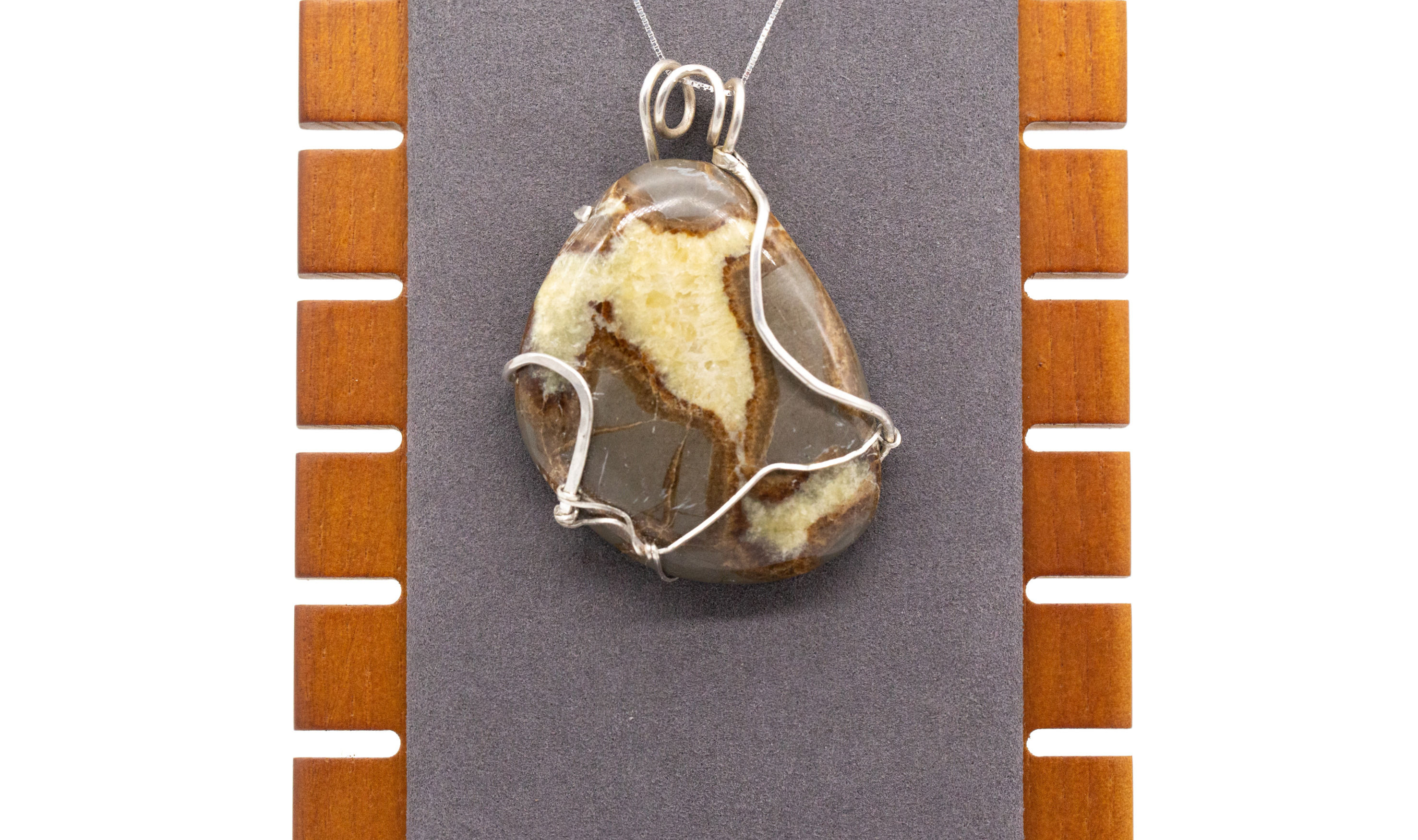 Septarian Nodule Pendant with Sterling Silver Wire. Has Curly Q Bail but No Additional Jump Ring.
