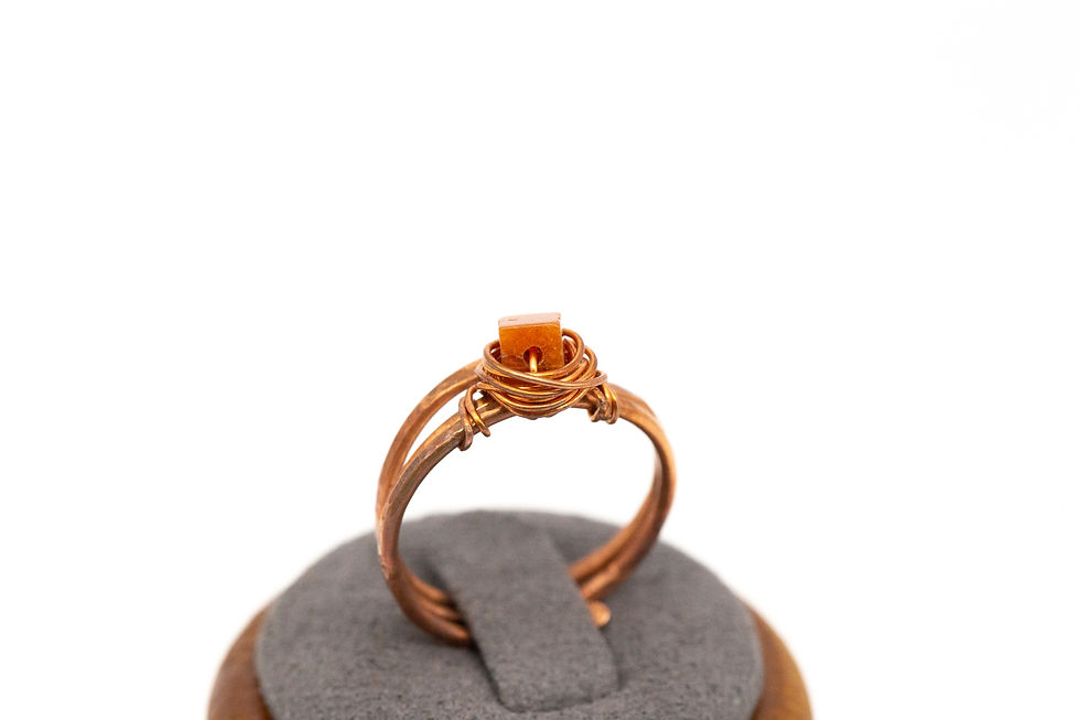 Thumbnail: Burnt orange carnelian birds’ nest ring in hammered copper.