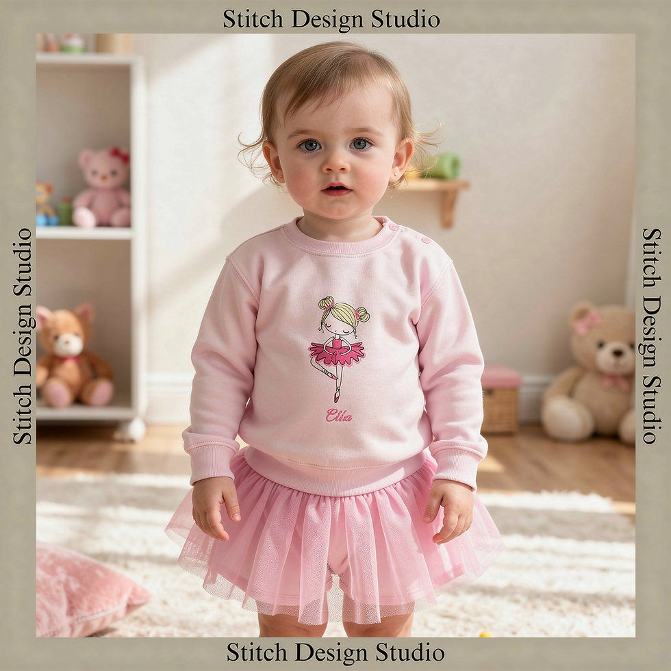 A toddler wearing a pink sweatshirt with a ballerina and her name embroidered on the front