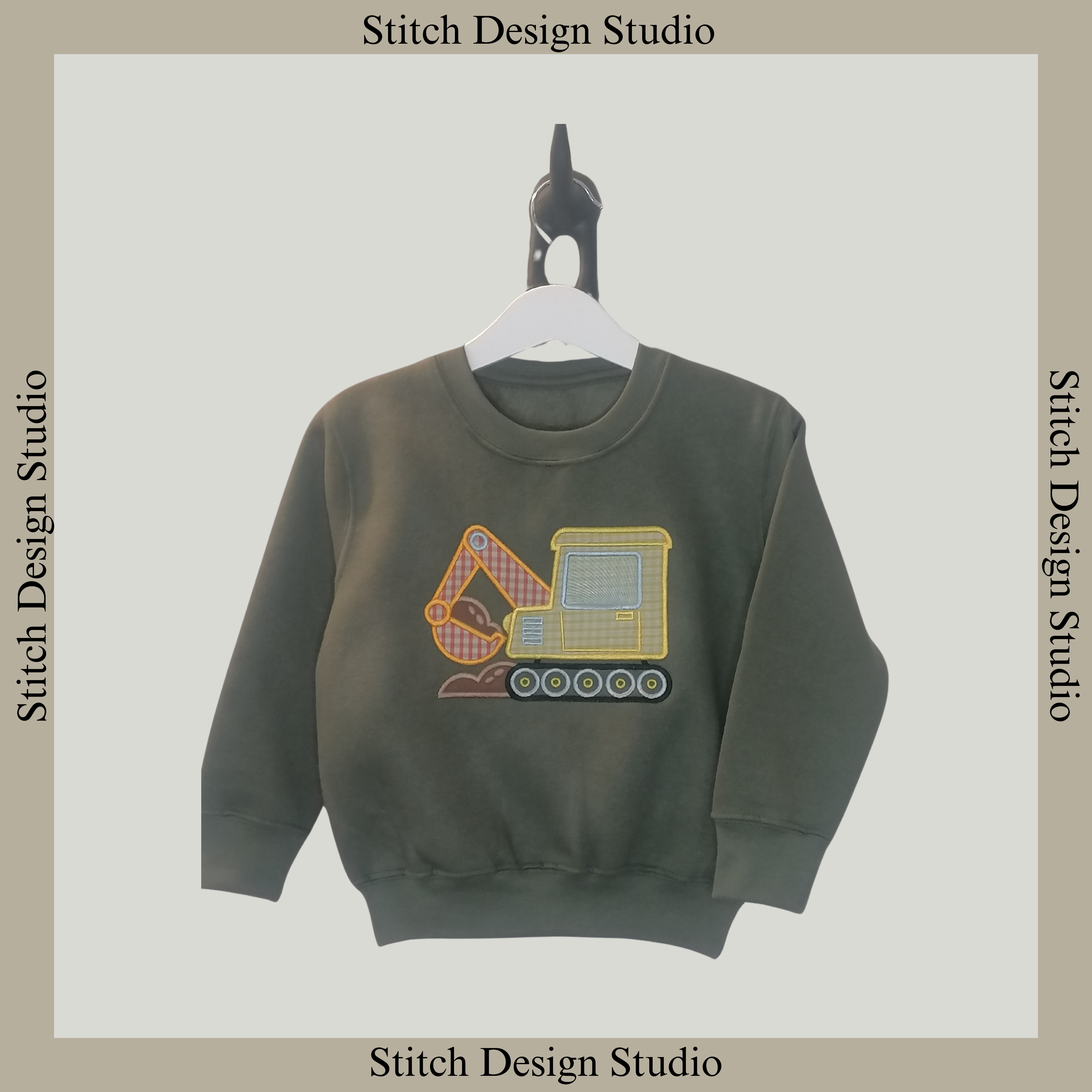 Green children's sweatshirt with a digger on the front using embroidery and applique with yellow and orange gingham fabric