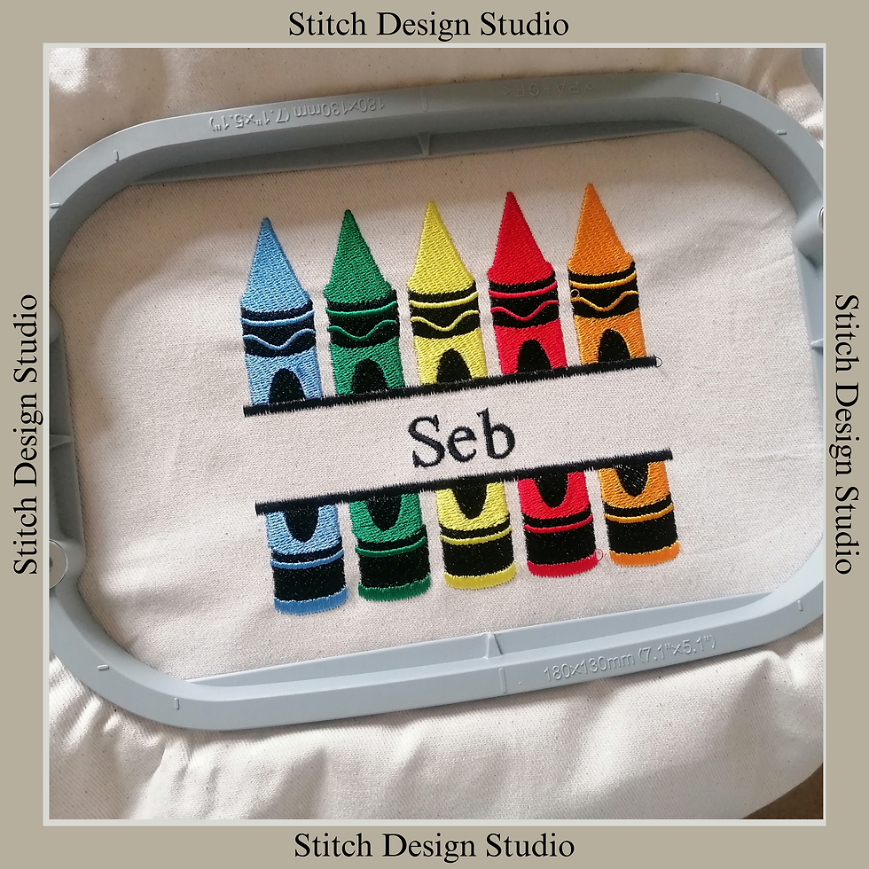 Thumbnail: child's cooking or crafting apron embroidered with 5 crayons in different colours and with a name embroidered in between