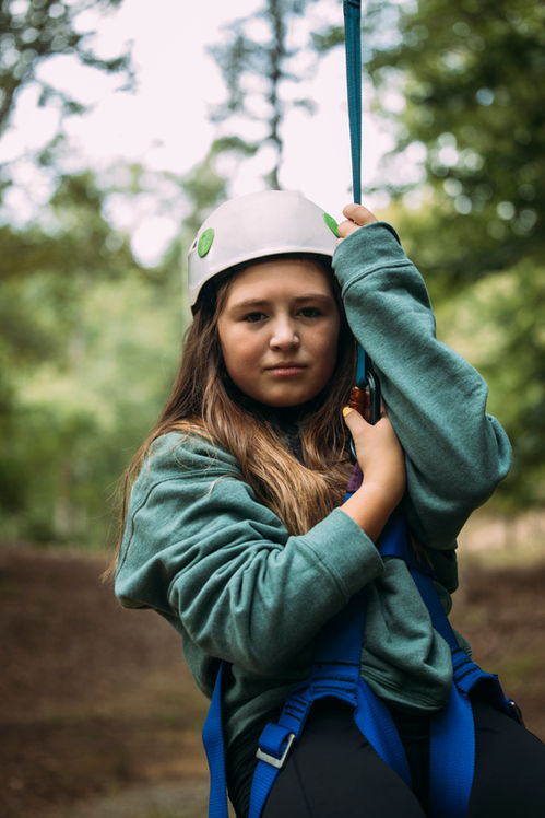 girlscout in helmet zipline