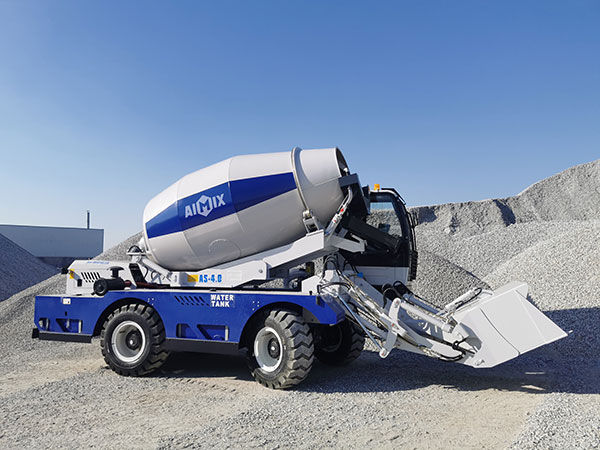 Self loading concrete mixer at work site