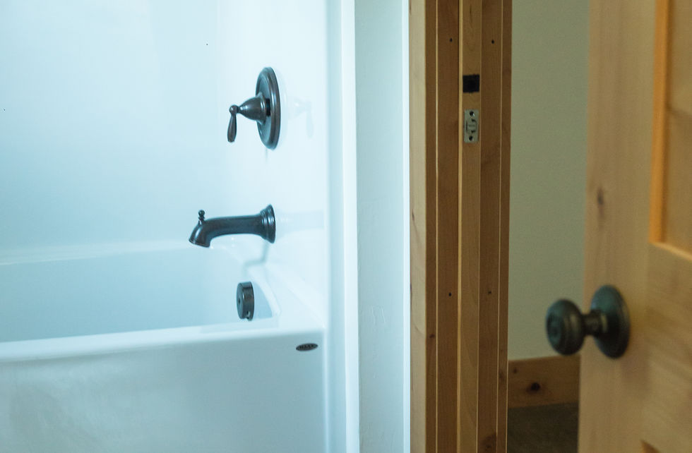 walk-in shower with light blue wall surround