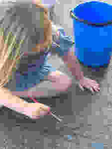 Fill up a bucket of water and paint the house, the driveway, the fence, and anything else that can get a little wet!