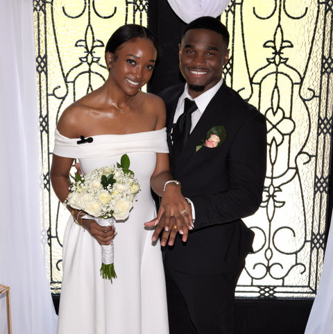 Happy couple shows off wedding rings