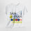 Thumbnail: white t-shirt with a San Francisco graphic featuring the Golden Gate Bridge, Transamerica Pyramid, cable car