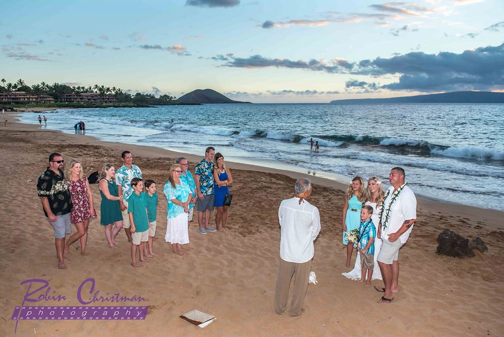 Couple and their family and friends gather on a Maui beach for a vow renewal ceremony