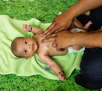 NEWBORN BABY MASSAGE CHEST WITH DAD 2.jpeg