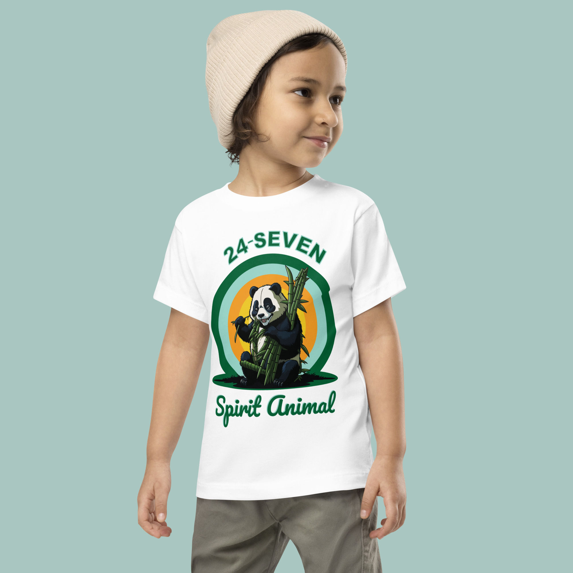 Toddler modelling white t-shirt, featuring panda bear in the sunset