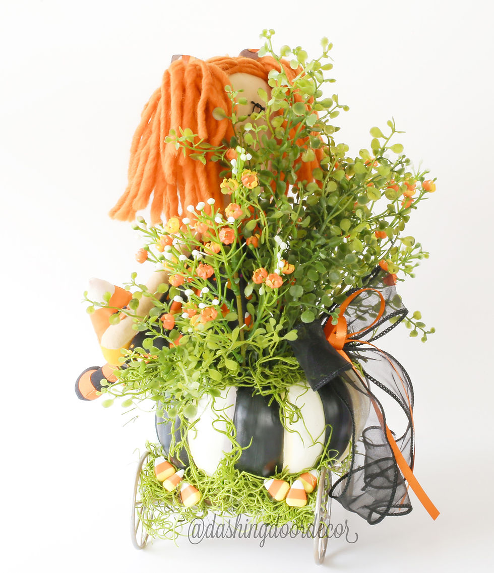 Thumbnail: Candy Corn Doll Centerpiece in Mackenzie Childs Spookarella Pumpkin Cart