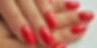 hands with regular manicure with red nail polish