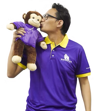 TY from Monster Day Tours kissing a plush monkey