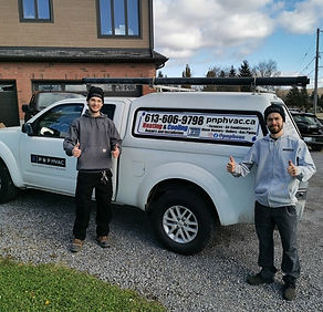 P & P HVAC owners standing in front of service truck in Ottawa
