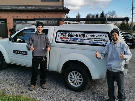 P & P HVAC owners in front of company truck