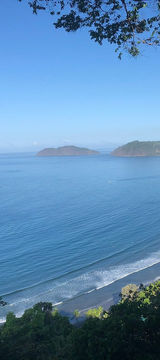 Panoramic view of Jacó bay and Pacific coastline from El Miro viewpoint, Costa Rica