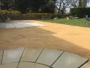 Patios joined by self-binding gravel area