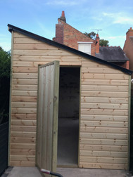 Shed with rubber roof finish