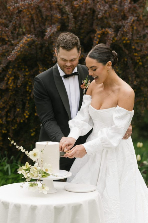Textured white buttercream wedding cake with floral statement at Deer Leap Farm