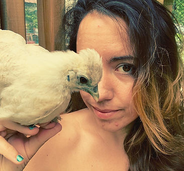 photograph of andrea decarlo with a white bantam chicken