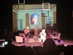 Actors performing a scene on stage (Live Garra Theatre)