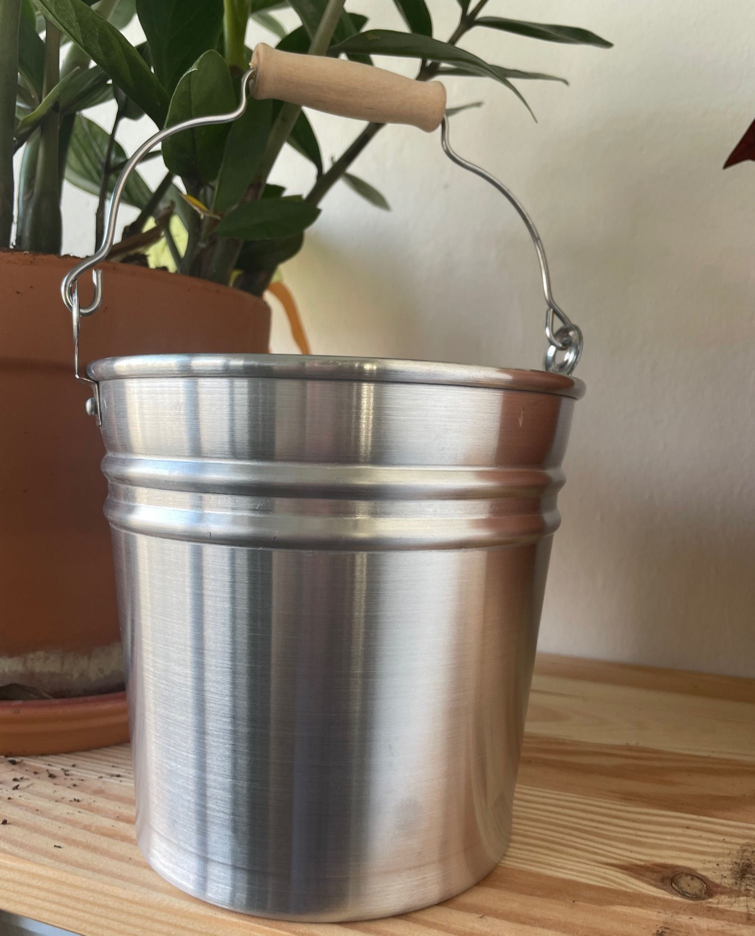 Bucket with wooden handle