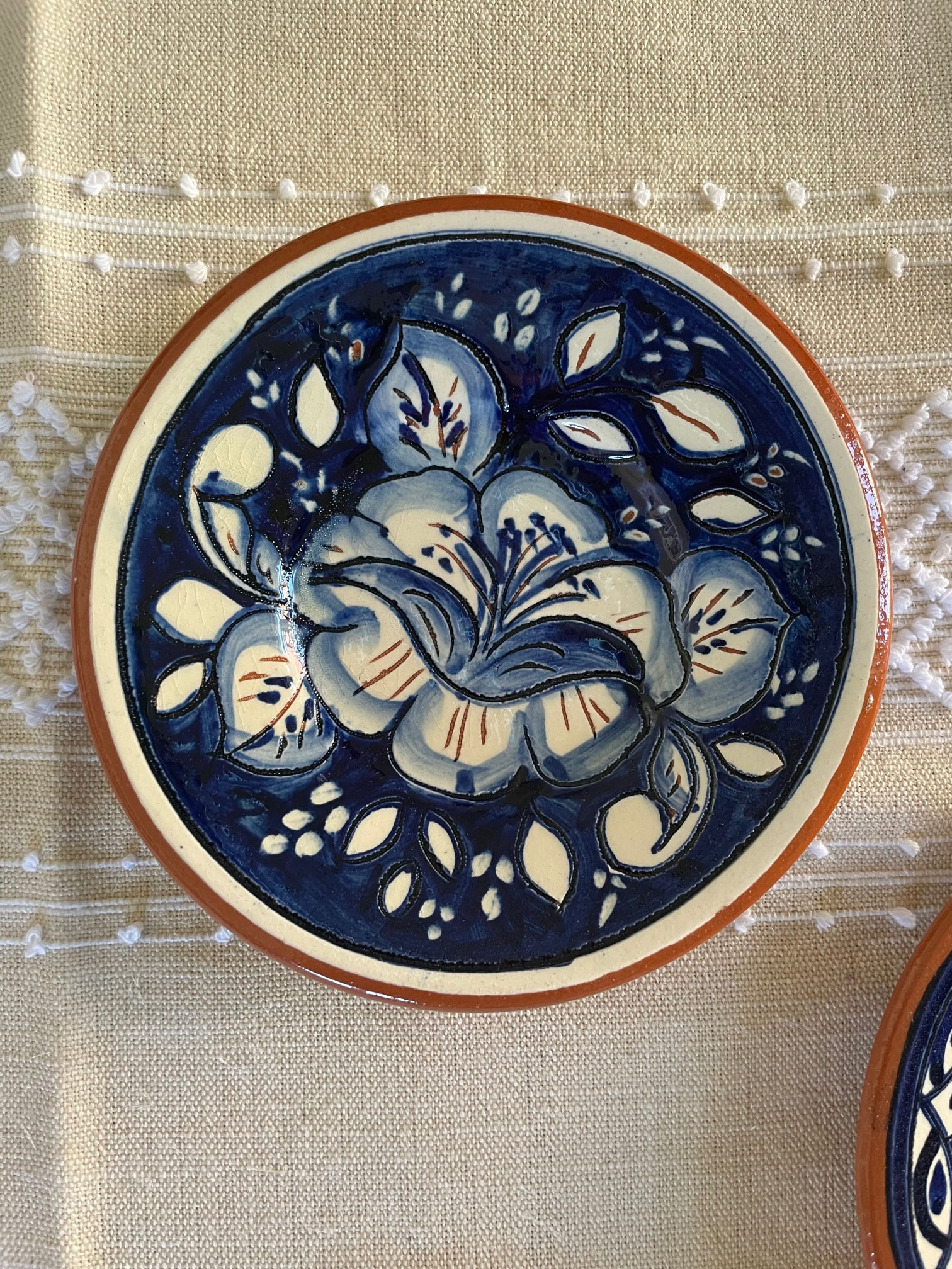 Flower painted clay plate